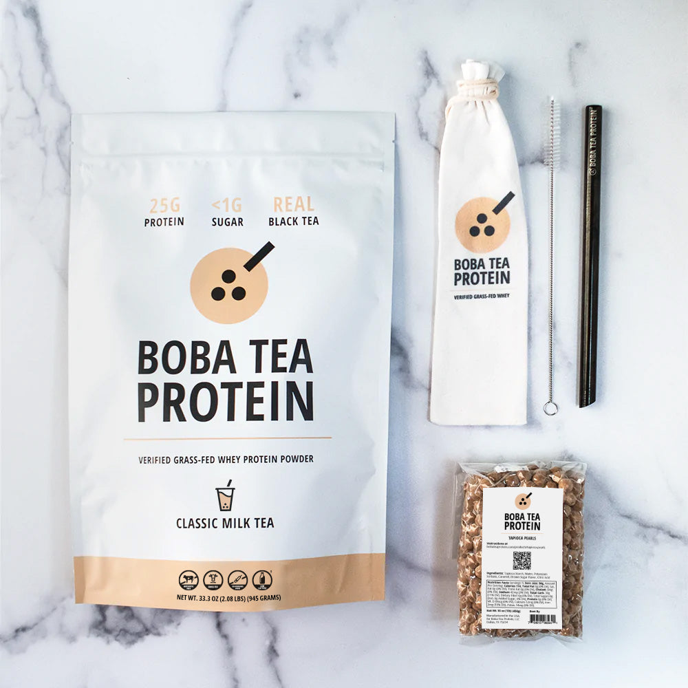 Boba Tea Protein whey protein, metal straw, and tapioca pearls on a marble background