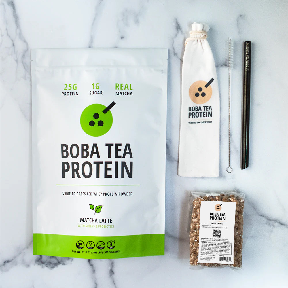 Boba Tea Protein whey protein, metal straw, and tapioca pearls on a marble background