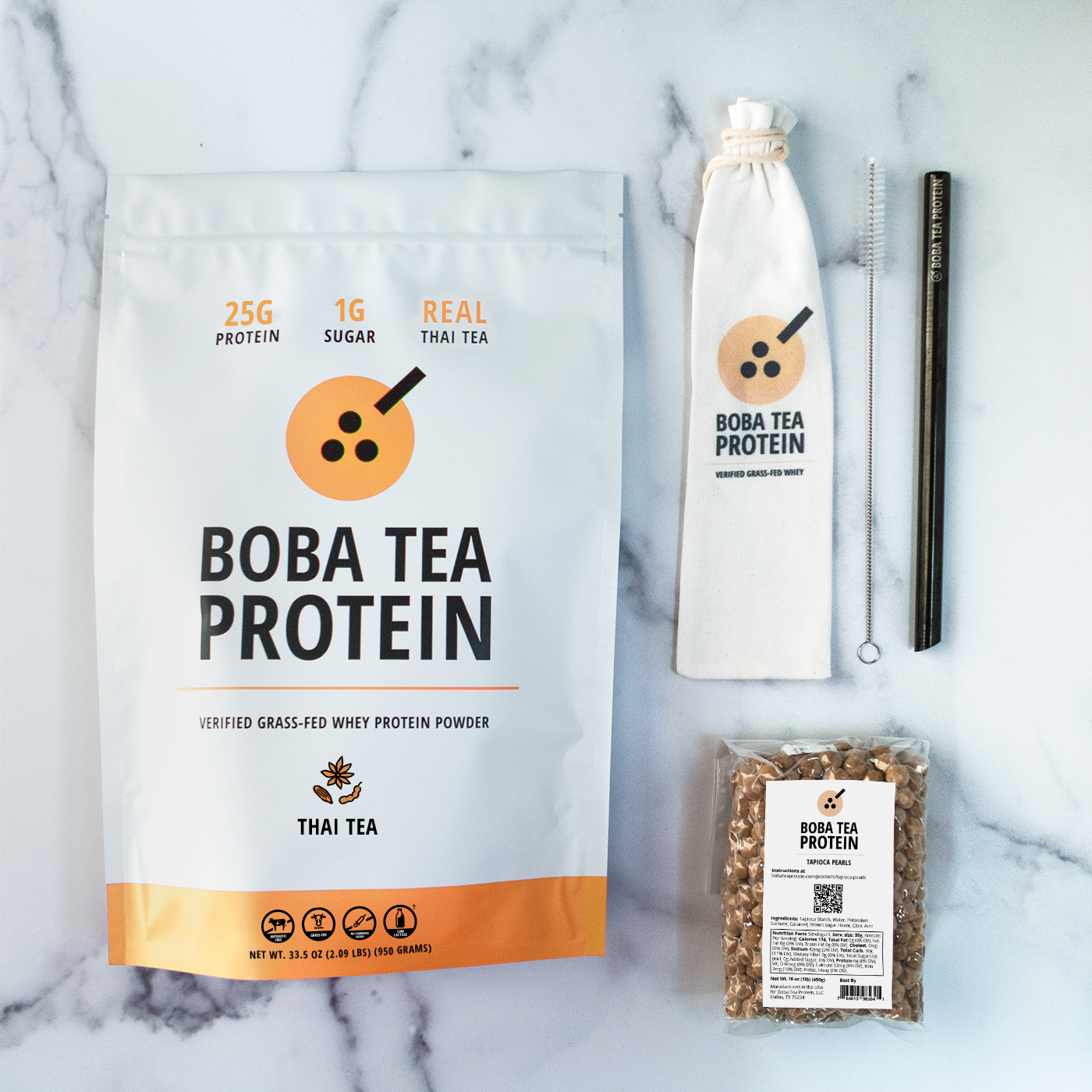 Boba Tea Protein whey protein, metal straw, and tapioca pearls on a marble background