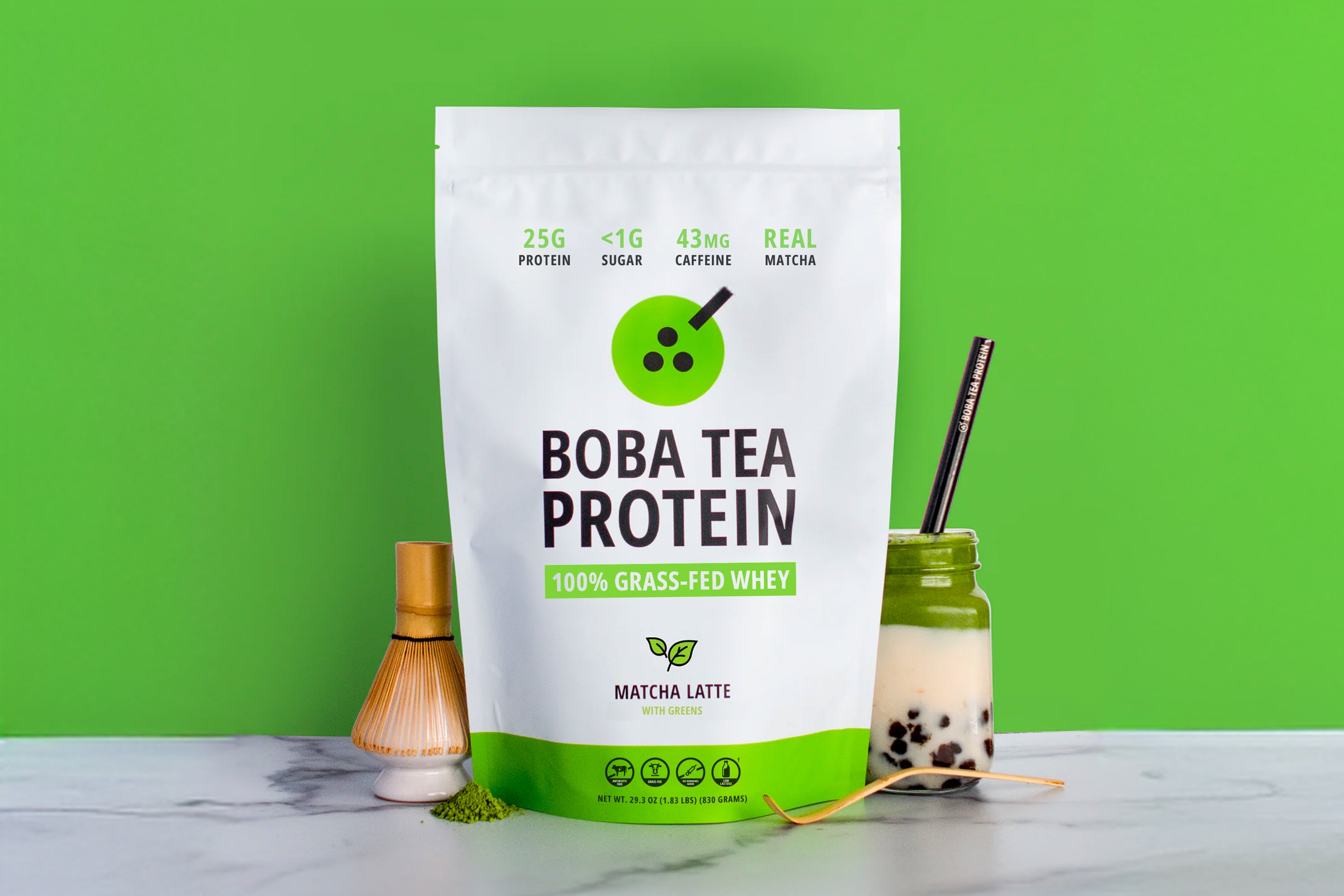 Boba tea protein package with a matcha latte on a green background