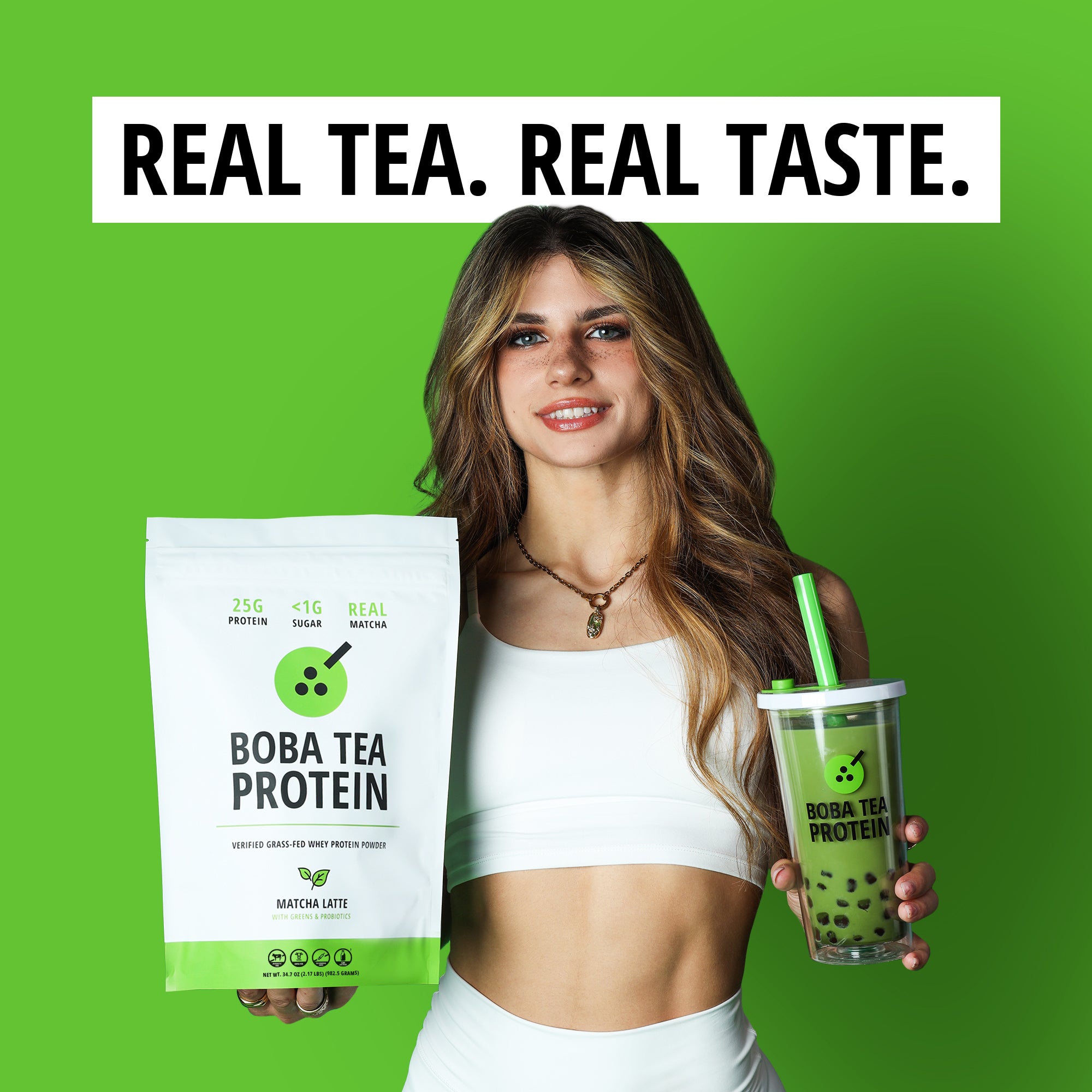 Woman holding Boba Tea Protein packaging and a green cup against a green background with text 'Real Matcha. Real Taste.'