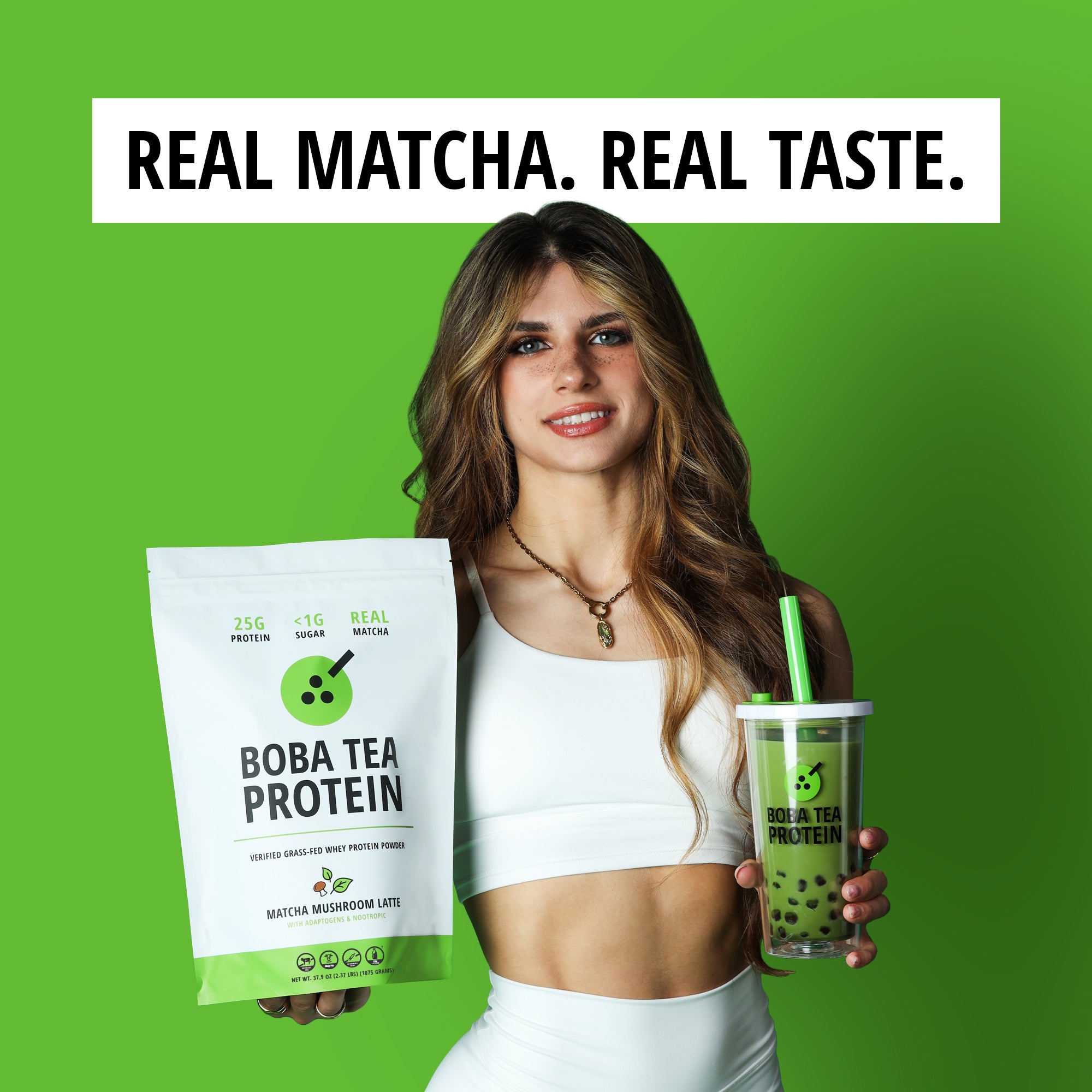 Woman holding Boba Tea Protein packaging and a green drink against a green background with text 'Real Matcha. Real Taste.'