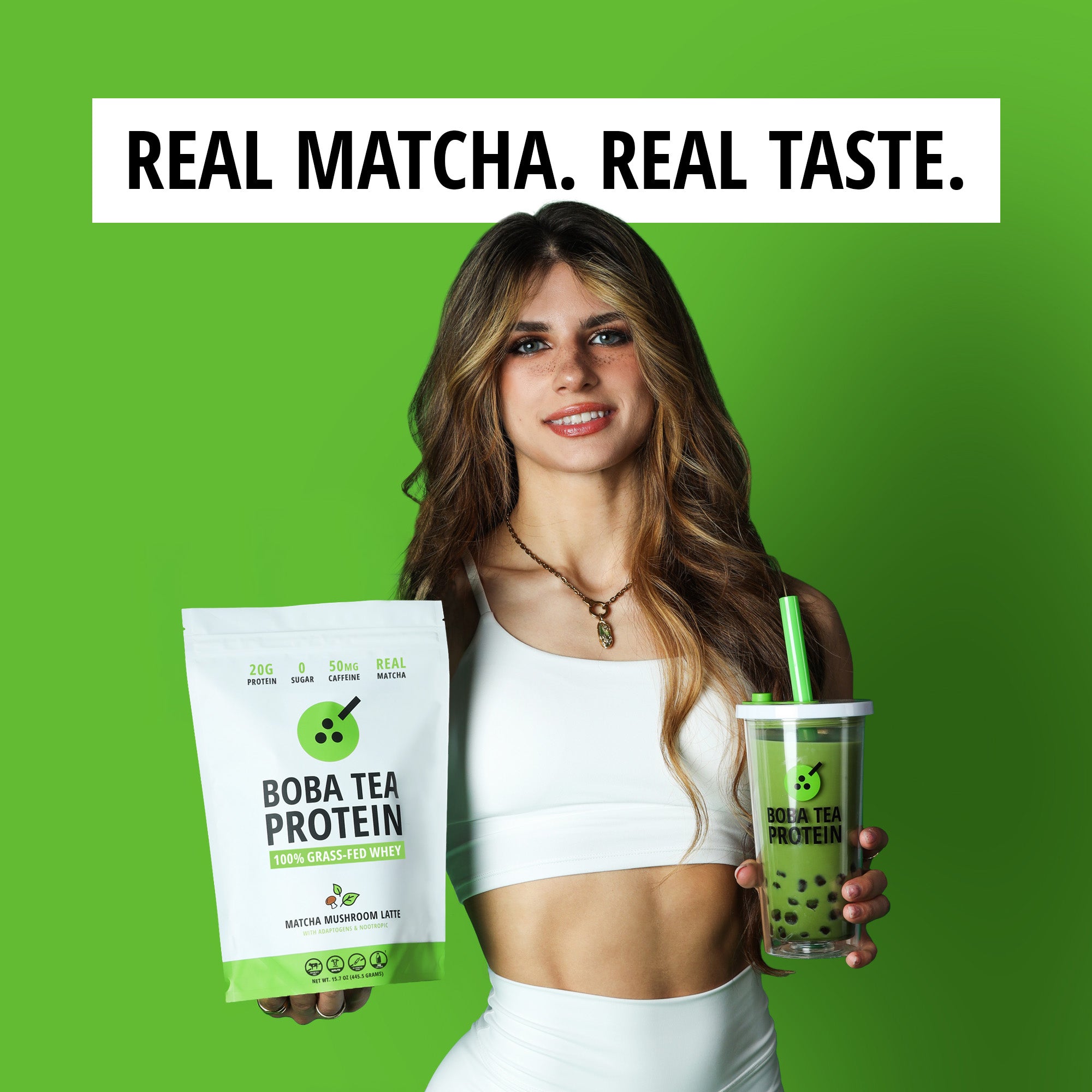 Woman holding Boba Tea Protein packaging and a green drink against a green background with text 'Real Matcha. Real Taste.'