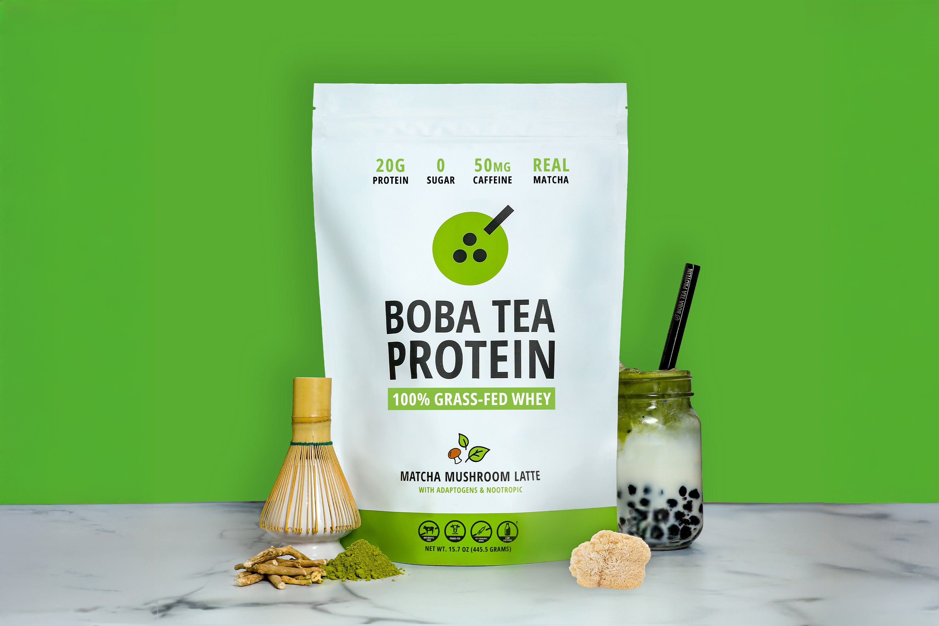 Boba tea protein powder package with matcha and adaptogen ingredients on a green background