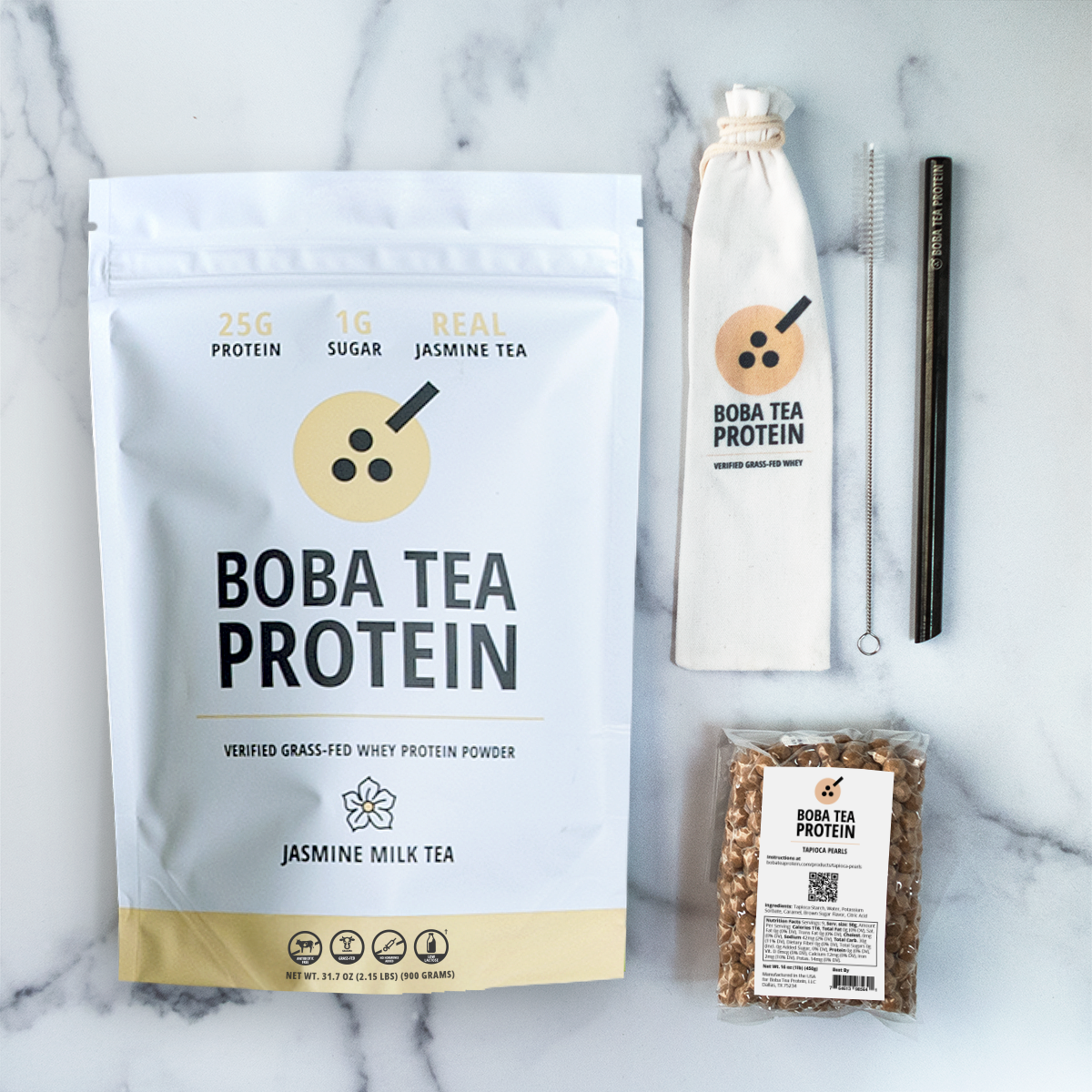 Boba Tea Protein whey protein, metal straw, and tapioca pearls on a marble background