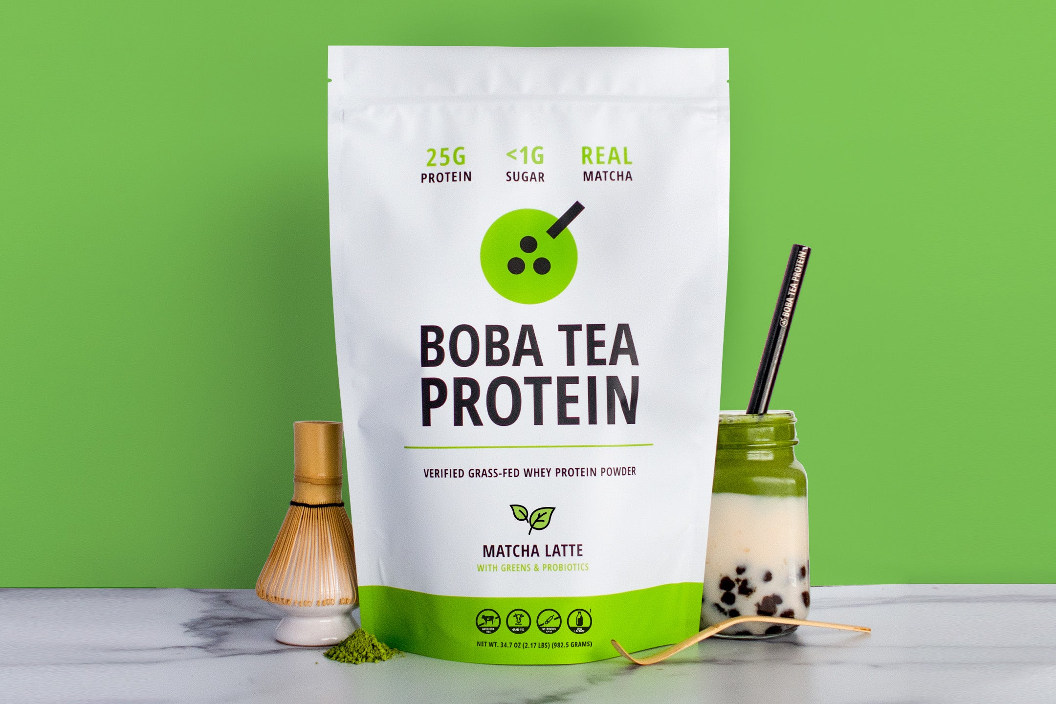 Boba tea protein package with a matcha latte on a green background